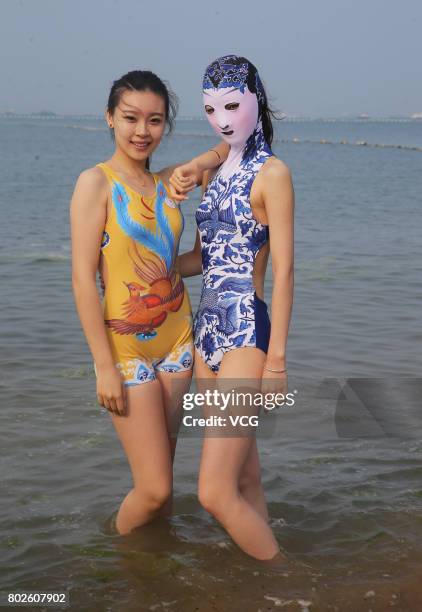 Model models the seventh version of facekini on a beach on June 28, 2017 in Qingdao, Shandong Province of China. The seventh version of facekini...