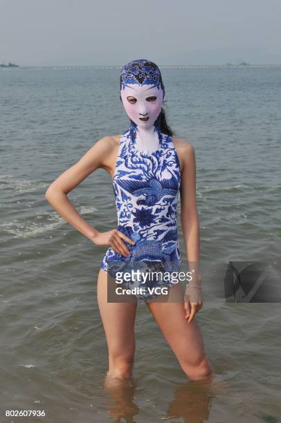 Model models the seventh version of facekini on a beach on June 28, 2017 in Qingdao, Shandong Province of China. The seventh version of facekini...