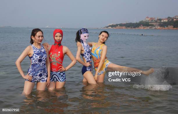 Model models the seventh version of facekini on a beach on June 28, 2017 in Qingdao, Shandong Province of China. The seventh version of facekini...