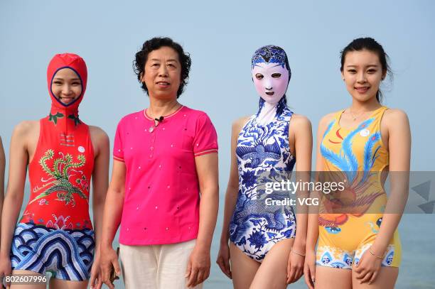 Model models the seventh version of facekini on a beach on June 28, 2017 in Qingdao, Shandong Province of China. The seventh version of facekini...