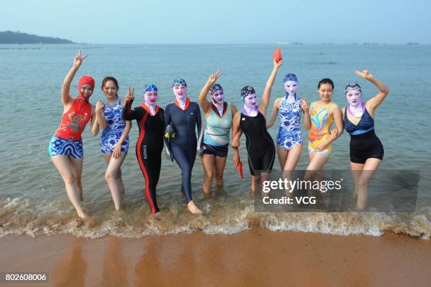 Model models the seventh version of facekini on a beach on June 28, 2017 in Qingdao, Shandong Province of China. The seventh version of facekini...