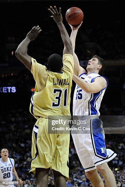 Brian Zoubek of the Duke Blue Devils shoots over Ganai Lawal of the Georgia Tech Yellow Jackets during day two of the 2008 Men's ACC Basketball...