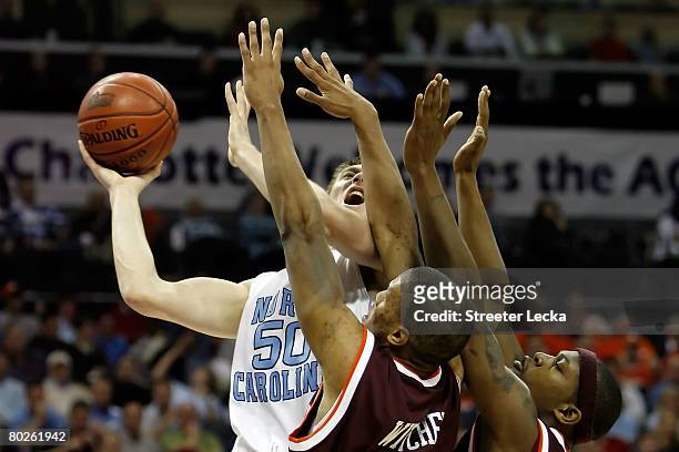 Tyler Hansbrough of the North Carolina Tar Heels shoots over Lewis Witcher and J.T. Thompson of the Virginia Tech Hokies during the semifinals of the...