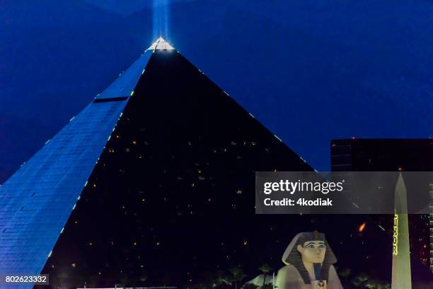 luxor casino building in las vegas nevada in the evening - luxor hotel stock pictures, royalty-free photos & images