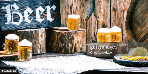 pub counter with beer and snack - in store beer display stock pictures, royalty-free photos & images