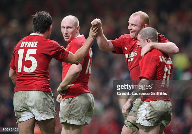 Martyn Williams of Wales is congratulated by teammates after scoring his team' s second try during the RBS Six Nations Championship match between...