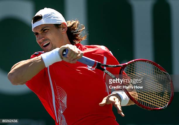 David Ferrer of Spain returns to Olivier Rochus of Belgium during the Pacific Life Open at the Indian Wells Tennis Garden March 15, 2008 in Indian...