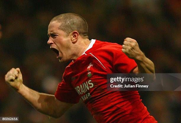 Shane Williams of Wales celebrates after scoring a try during the RBS Six Nations Championship match between Wales and France at the Millennium...