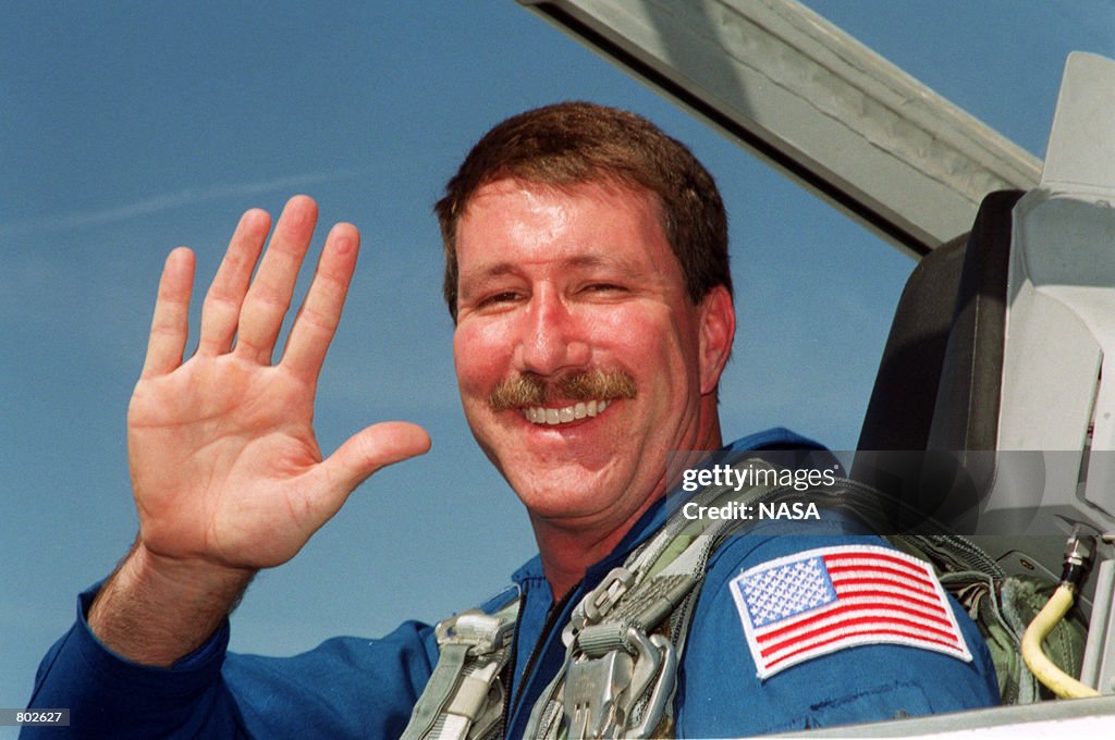 Lawrence Rominger Commander Kent V. Rominger waves from a jet April 17, 2001 as he ...