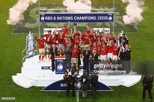 Captain Ryan Jones holds the trophy as his team celebrate winning the RBS Six Nations Championship match between Wales and France at the Millennium...