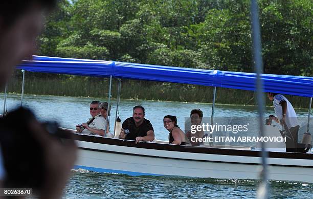 Tourists enjoy a ride along the Dulce River, some 250 km northeast of Guatemala City on March 15, 2008. Some 400 police and soldiers were searching...