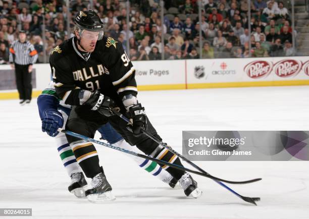 Brad Richards of the Dallas Stars handles the puck against the Vancouver Canucks at the American Airlines Center on March 15, 2008 in Dallas, Texas.