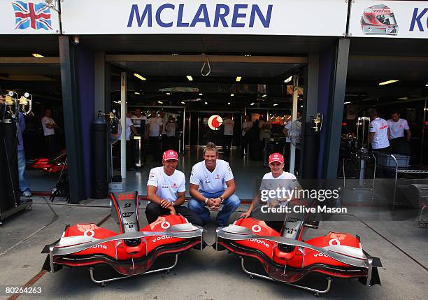 Mclaren Mercedes drivers Lewis Hamilton of Great Britain and Heikki Kovalainen of Finland meet Australian cricket legend Shane Warne before the...