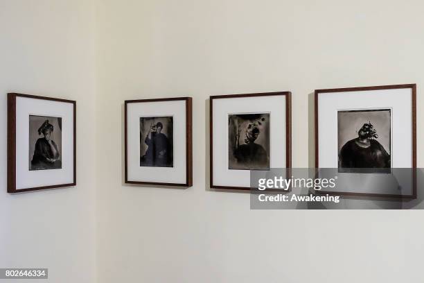 Photographs on display by artist Khadija Saye are seen at the Diaspora pavilion at Biennale Arte 2017 on June 28, 2017 in Venice, Italy. The work of...