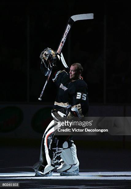 Goaltender J.S. Giguere of the Anaheim Ducks skates on the ice to acknowledge the fans after being named the second star of the game by the local...