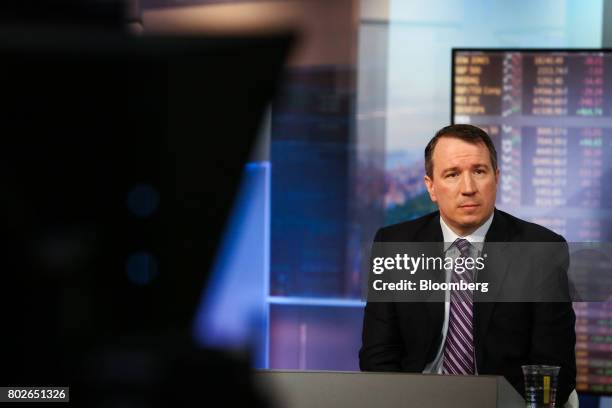 Michael O'Rourke, chief market strategist at Jonestrading Institutional Services LLC, listens during a Bloomberg Television interview in New York,...