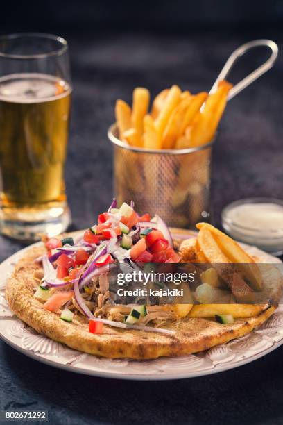 greek gyros with french fries - tzatziki sauce isolated stock pictures, royalty-free photos & images