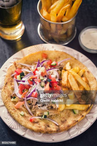 greek gyros with french fries - tzatziki sauce isolated stock pictures, royalty-free photos & images