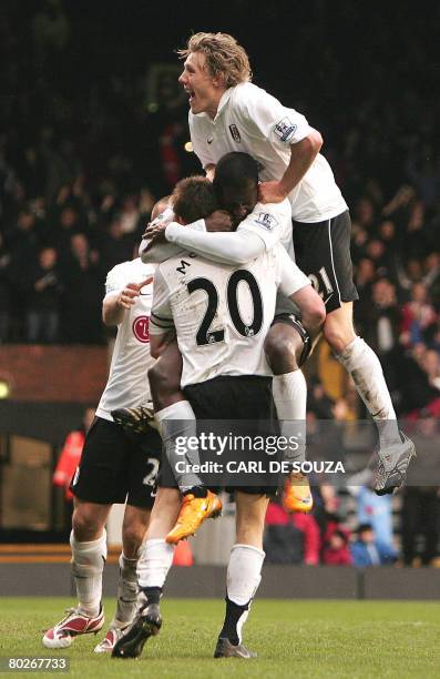 Fulham's Eddie Johnson , captain Brian McBride and Jimmy Bullard celebrate McBride's goal during their Premiership match against Everton at Fulham's...