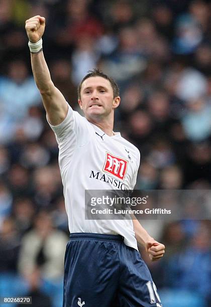 Robbie Keane of Tottenham Hotspur celebrates scoring the opening goal during the Barclays Premier League match between Manchester City and Tottenham...