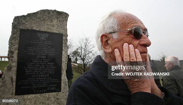 Jan Dresner, a Jew saved from the Holocaust by German industrialist Oskar Schindler reacts opposite the memorial plaque in the former Nazi...