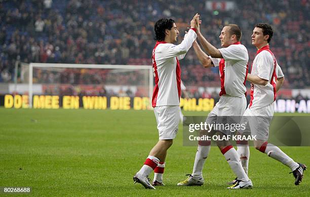 Ajax-player Luis Suarez celebrates marking the third goal with teamplayers John Heitinga and Thomas Vermaelen during the Premier League soccer match...