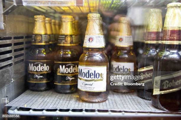 Bottles of Constellation Brands Inc. Modelo beer sit in a cooler at a restaurant in Ottawa, Illinois, U.S., on Tuesday, June 27, 2017. Constellation...