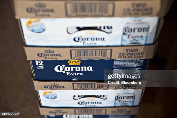 Cases of Constellation Brands Inc. Corona beer sit in a storage room at a restaurant in Ottawa, Illinois, U.S., on Tuesday, June 27, 2017....