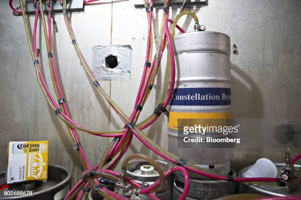 Quarter keg of Constellation Brands Inc. Modelo beer sits inside a cooler at a restaurant in Ottawa, Illinois, U.S., on Tuesday, June 27, 2017....