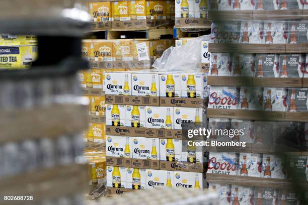 Cases of Constellation Brands Inc. Corona beer sit inside the Euclid Beverage LLC warehouse in Peru, Illinois, U.S., on Tuesday, June 27, 2017....