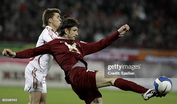 Dmitry Torbinsky of FC Lokomotiv Moscow compete for the ball with Roman Sharonov of FC Rubin Kazan during the Russian Football League Championship...