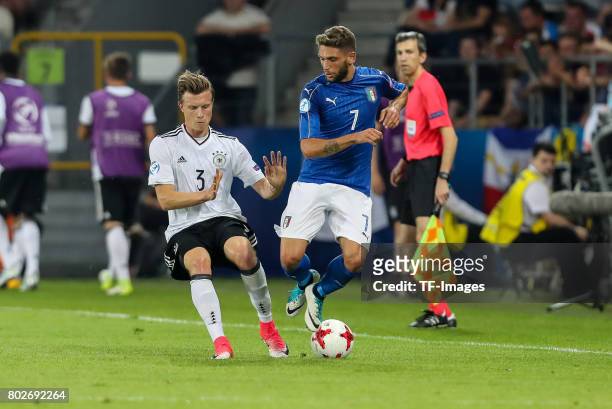 Yannick Gerhardt of Germany and Domenico Berardi of Italy battle for the ball during the UEFA U21 championship match between Italy and Germany at...