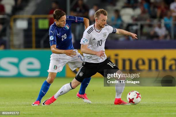 Federico Chiesa of Italy and Maximilian Arnold of Germany battle for the ball during the UEFA U21 championship match between Italy and Germany at...