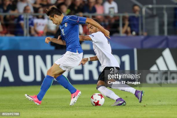 Federico Chiesa of Italy and Jeremy Toljan of Germany battle for the ball during the UEFA U21 championship match between Italy and Germany at Krakow...