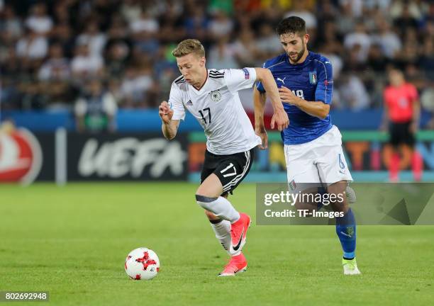 Mitchell Weiser of Germany and Roberto Gagliardini of Italy battle for the ball during the UEFA U21 championship match between Italy and Germany at...