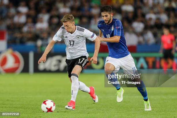 Mitchell Weiser of Germany and Roberto Gagliardini of Italy battle for the ball during the UEFA U21 championship match between Italy and Germany at...