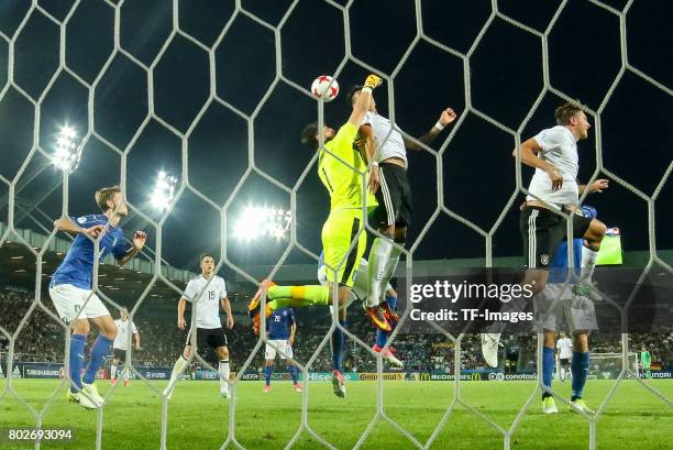 Goalkeeper Gianluigi Donnarumma of Italy and Davie Selke of Germany battle for the ball during the UEFA U21 championship match between Italy and...