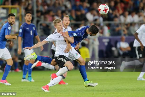 Mitchell Weiser of Germany and Roberto Gagliardini of Italy battle for the ball during the UEFA U21 championship match between Italy and Germany at...