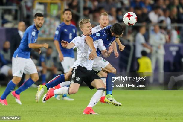 Mitchell Weiser of Germany and Roberto Gagliardini of Italy battle for the ball during the UEFA U21 championship match between Italy and Germany at...