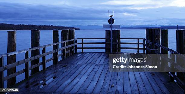 Dark rain clouds are seen over the Ammersee lake on March 16, 2008 in Stegen am Ammersee, Germany. The weather forecasts predict wet, rainy and...