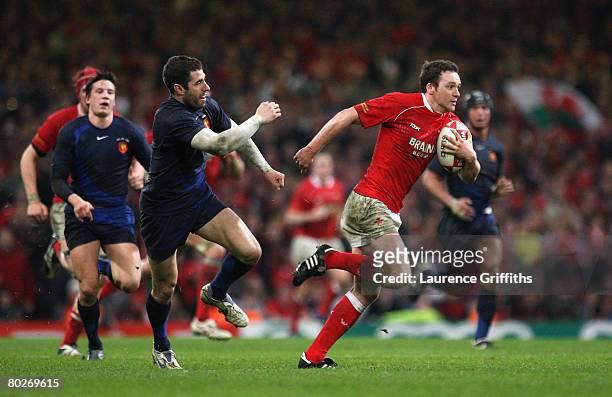 Mark Jones of Wales goes past Julien Malzieu of France during the RBS Six Nations Championship match between Wales and France at the Millennium...