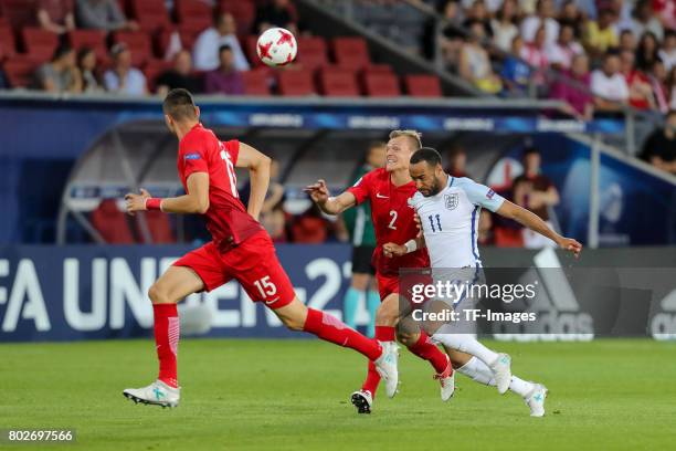 Jaroslaw Jach of Poland Pawel Jaroszynski of Poland and Nathan Redmond of England battle for the ball during the UEFA European Under-21 Championship...
