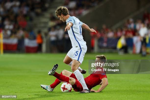 John Swift of England and Radoslaw Murawski of Poland battle for the ball during the UEFA European Under-21 Championship Group A match between...