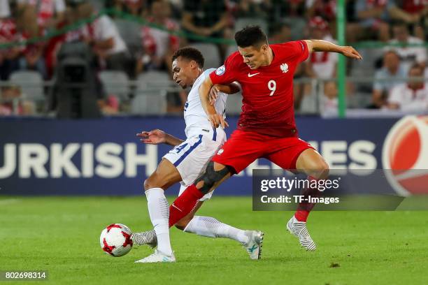 Jacob Murphy of England and Mariusz Stepinski of Poland battle for the ball during the UEFA European Under-21 Championship Group A match between...