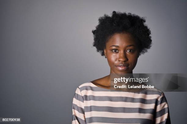 portrait of young african american woman - african american woman serious stock-fotos und bilder