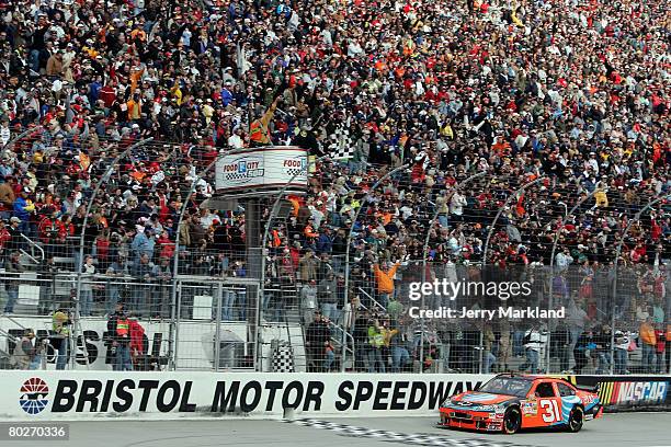 Jeff Burton, driver of the AT&T Mobility Chevrolet, crosses the finish line to win the NASCAR Sprint Cup Series Food City 500 at the Bristol Motor...