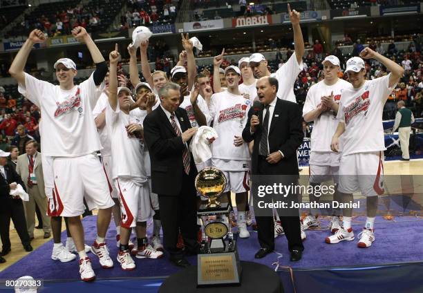 Big Ten Commissioner Jim Delany presents head coach Bo Ryan and the players from the Wisconsin Badgers with the Big Ten Tournament Championship...