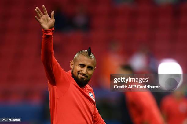 Chile's midfielder Arturo Vidal arrives in the pitch for the start of the 2017 Confederations Cup semi-final football match between Portugal and...