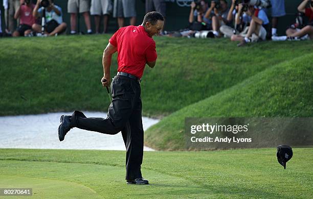 Tiger Woods celebrates making a birdie on the 18th green to win the Arnold Palmer Invitational on March 16, 2008 at the Bay Hill Club and Lodge in...