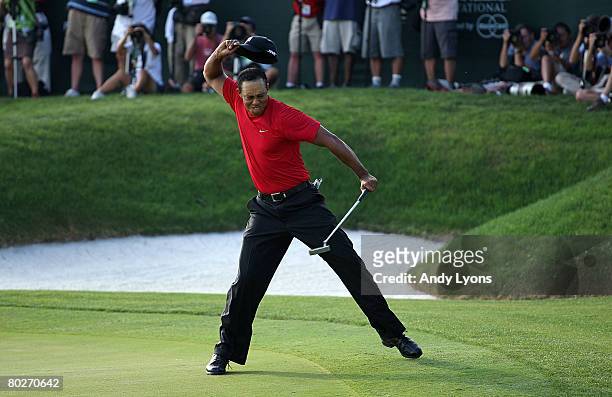 Tiger Woods celebrates making a birdie on the 18th green to win the Arnold Palmer Invitational on March 16, 2008 at the Bay Hill Club and Lodge in...